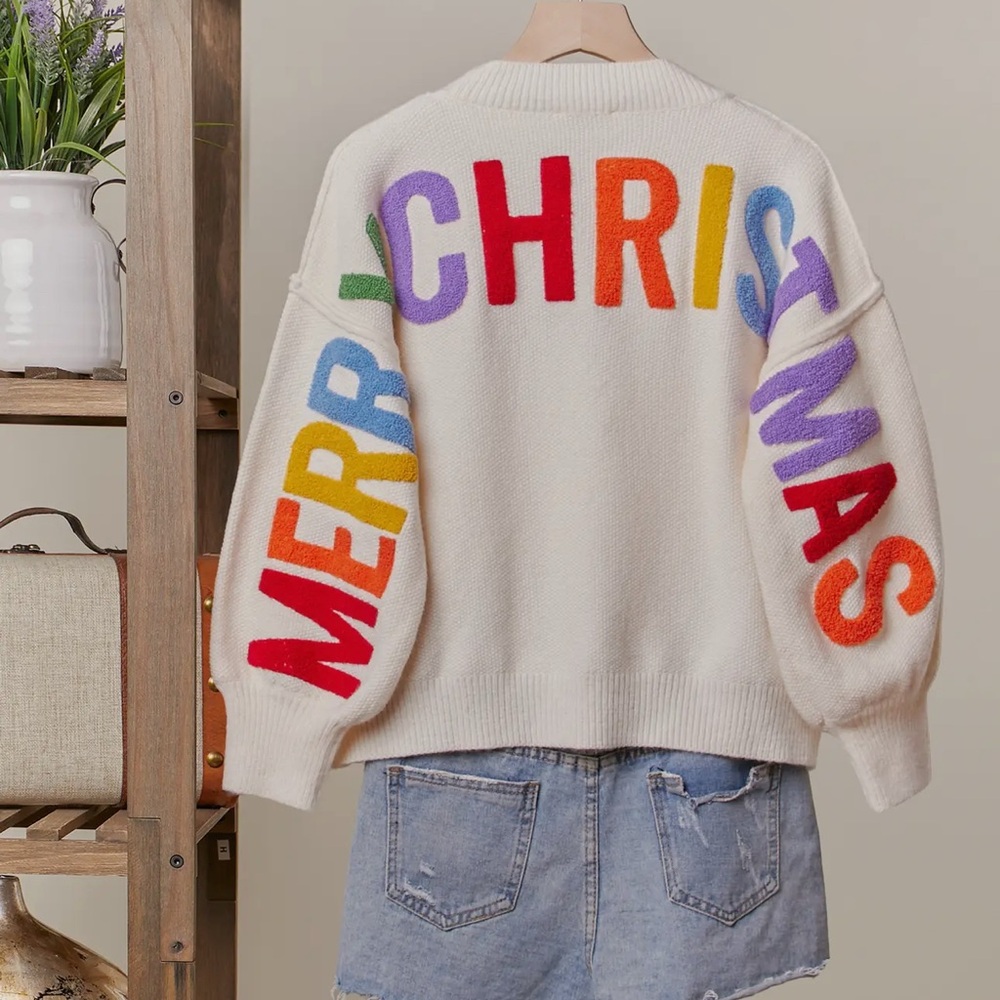 RARE and unique Oversized “Merry Christmas” luxe
Sweater with bubble sleeves